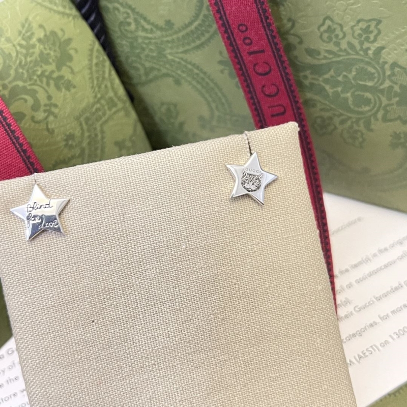 G*u*i earrings